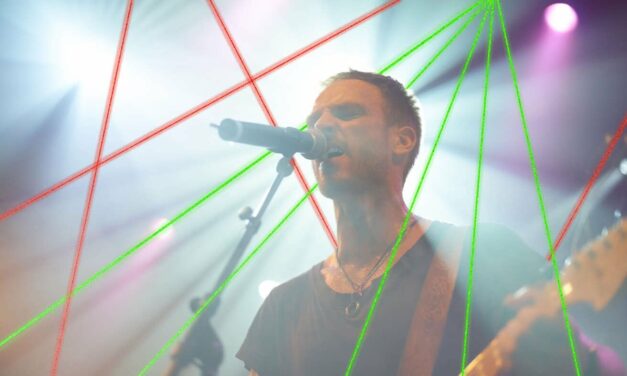 ‘Let’s Set Aside Distractions,’ Says Worship Leader Surrounded By Lasers And Fog