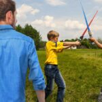 Dad Tears Up A Little As Son Shouts ‘I Have The High Ground!’ During Lightsaber Duel