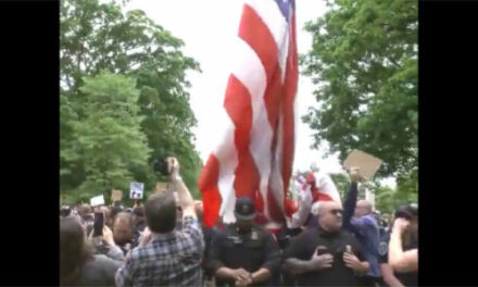 WATCH: The heartwarming moment when the American flag is once against hoisted at UNC’s campus