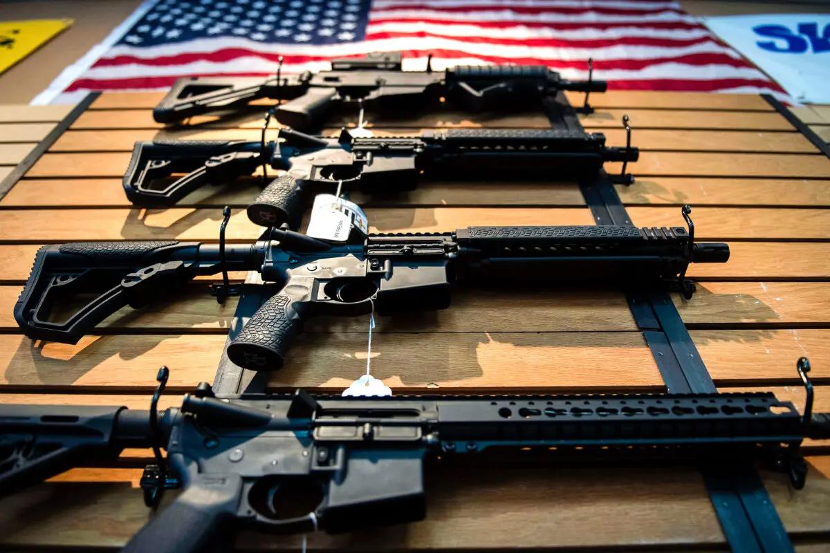 Semi-automatic rifles hang on the wall for sale at Blue Ridge Arsenal in Chantilly, Virginia, on October 6, 2017. (JIM WATSON/AFP via Getty Images)