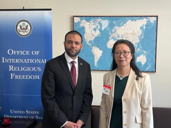Rashad Hussain (L), ambassador-at-large for international religious freedom, and Falun Gong practitioner Zhang Yuhua at the State Department's religious freedom report launch in Washington on June 26, 2024. (Courtesy of Zhang Yuhua)