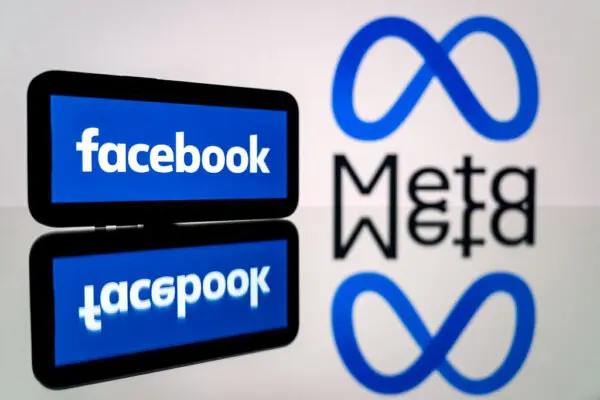 A smartphone and a computer screen displaying the logos of the social network Facebook and its parent company Meta in Toulouse, southwestern France, on Jan. 12, 2023. (Lionel Bonaventure/AFP via Getty Images)