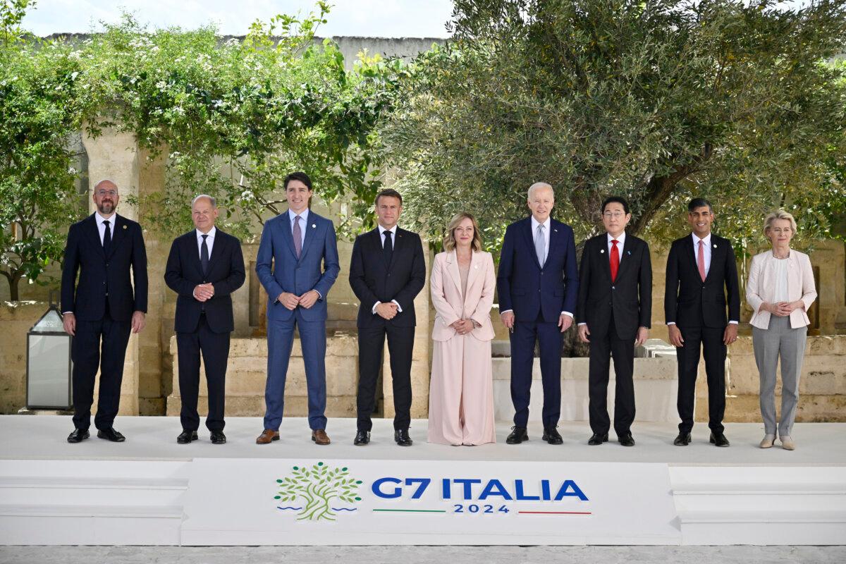 (L–R) European Council President Charles Michel, German Chancellor Olaf Scholz, Canadian Prime Minister Justin Trudeau, French President Emmanuel Macron, Italian Prime Minister Giorgia Meloni, U.S. President Joe Biden, Japanese Prime Minister Fumio Kishida, British Prime Minister Rishi Sunak and European Commission President Ursula von der Leyen pose for a family photo during a welcome ceremony on day one of the 50th G7 summit at Borgo Egnazia in Fasano, Italy, on June 13, 2024. (Antonio Masiello/Getty Images)