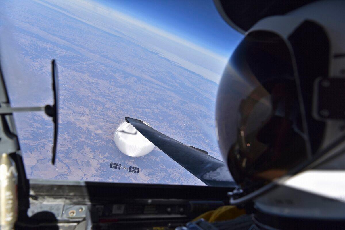 A U.S. Air Force pilot looked down at the suspected Chinese surveillance balloon as it hovered over the Central Continental United States on Feb. 3, 2023. Recovery efforts began shortly after the balloon was downed. (Courtesy of the Department of Defense via Getty Images)
