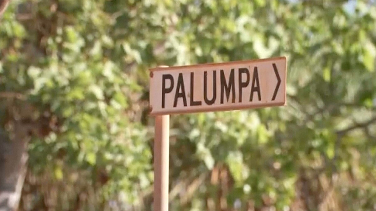 A road sign points to the Indigenous region of Palumpa in Australia