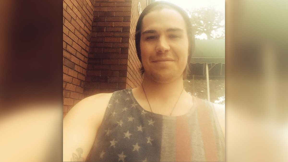 Hooiman wearing an American flag tank top in a selfie