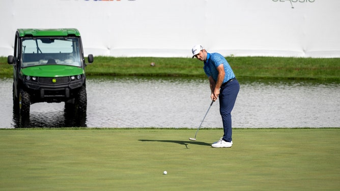 Denny McCarthy hits a putt on the 18th green during the third round of the 2024 John Deere Classic. (Marc Lebryk-USA TODAY Sports)