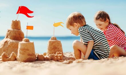 Kids Happily Building Sandcastle On Beach Totally Unaware That Democracy May End This November