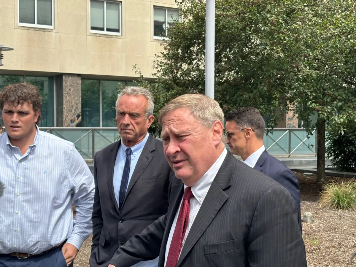 Attorney Paul Rossie (R), and independent presidential candidate Robert F. Kennedy Jr. (2nd L), talk to reporters in Harrisburg, Pa. on Aug. 20 after a ballot access hearing. (Jeff Louderback/The Epoch Times)