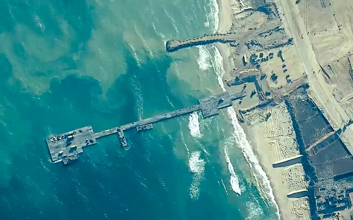 U.S. Army soldiers assigned to the 7th Transportation Brigade (Expeditionary), U.S. Navy sailors assigned to Amphibious Construction Battalion 1, and Israel Defense Forces placing the Trident Pier on the coast of the Gaza Strip on May 16, 2024. (U.S. Central Command via AP)