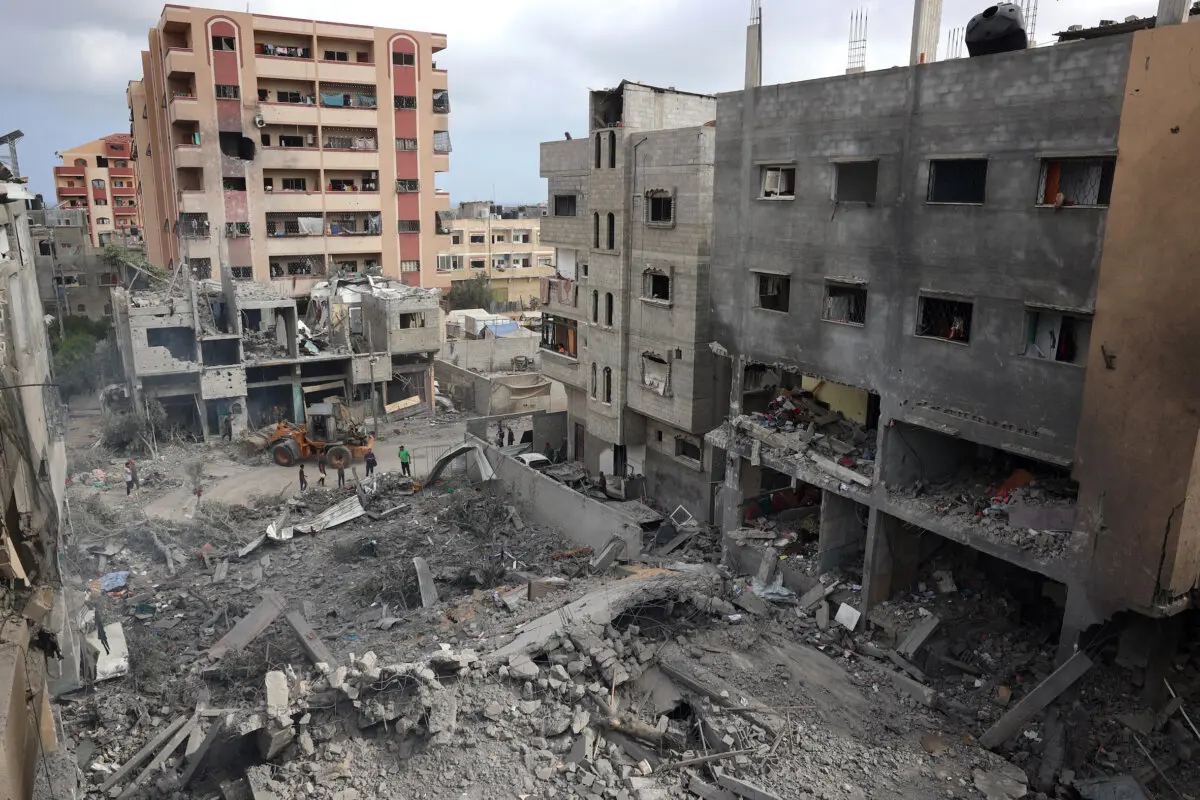 Palestinians inspect the damage and debris a day after an operation by the Israeli Special Forces in the Nuseirat camp, in the central Gaza Strip on June 9, 2024. (Eyad Baba/Getty Images)