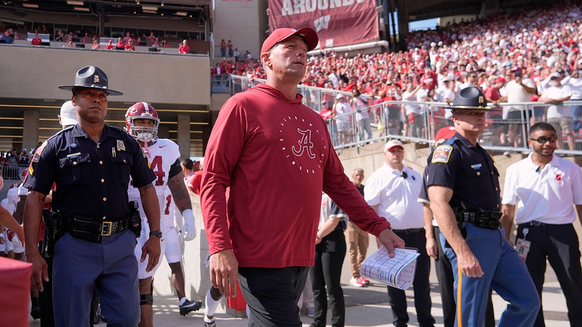 Kalen DeBoer walks on the field