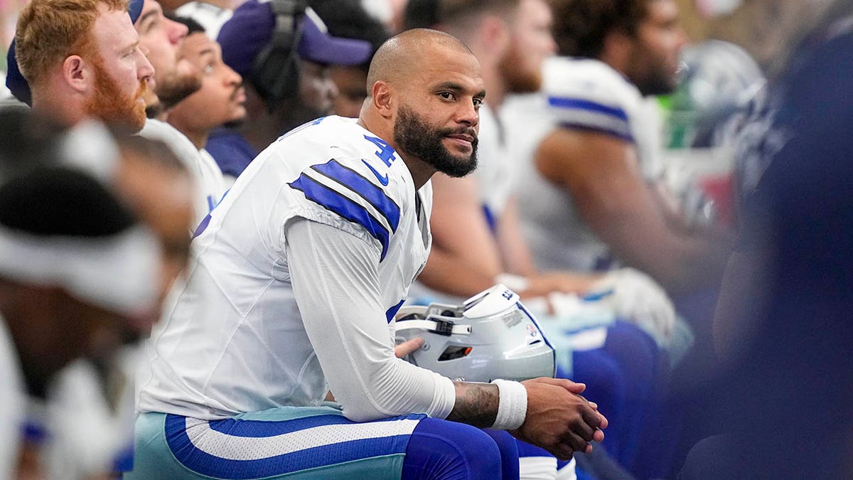 Dak Prescott sits on bench