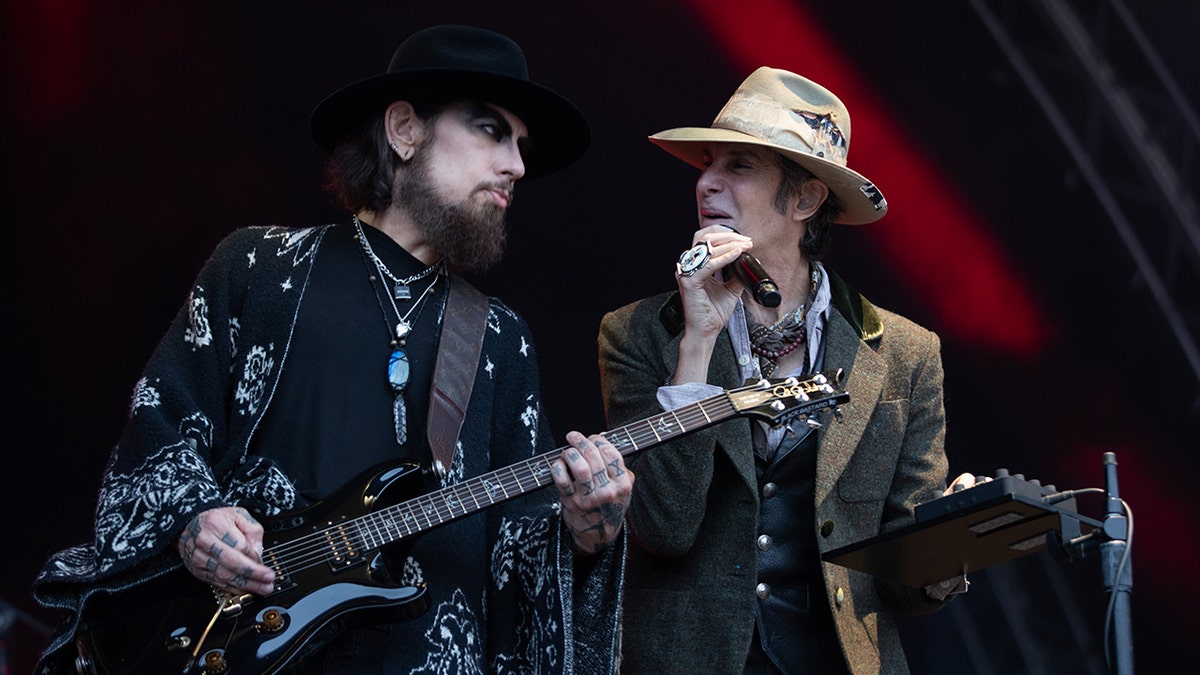 Dave Navarro and Perry Farrell performing on stage together