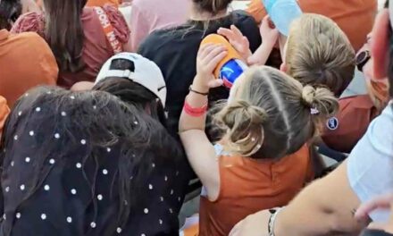 Umm, was this toddler pounding a Michelob beer at the UT game? Watch the video and tell us what you think.