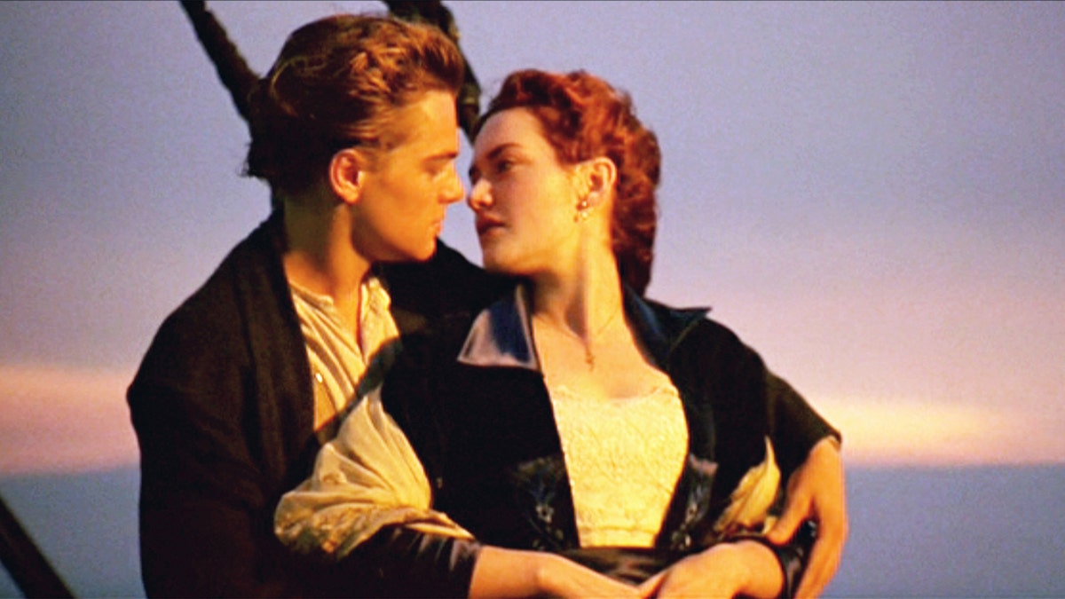 Kate Winslet looks back at Leonardo DiCaprio in character as Rose and Jack on the boat during a scene from the 