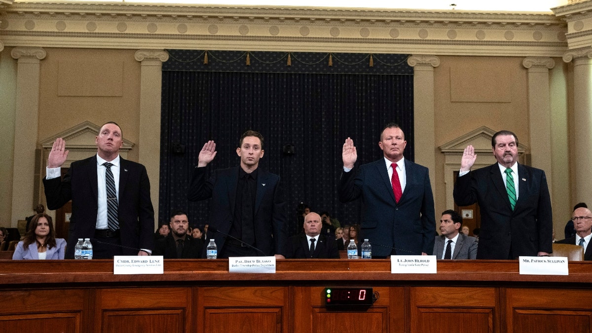 From left, Sgt. Edward Lenz, Commander of Butler County Emergency Services Unit, Patrolman Drew Blasko of Butler Township Police Dept., Lt. John Herold of Pennsylvania State Police, and former U.S. Secret Service agent Patrick Sullivan, swear in at the first public hearing of a bipartisan congressional task force investigating the assassination attempts against Republican presidential nominee former President Donald Trump, at Capitol Hill in Washington, Thursday, Sept. 26, 2024.