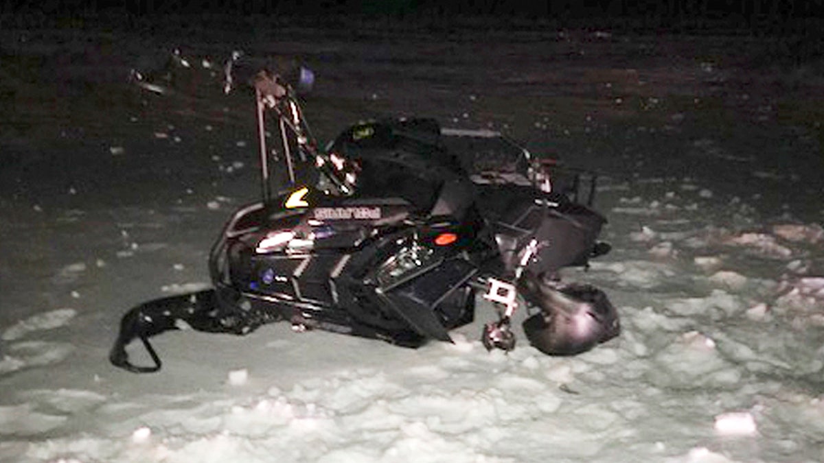 Jeff Smith snowmobile after crashing into Black Hawk helicopter