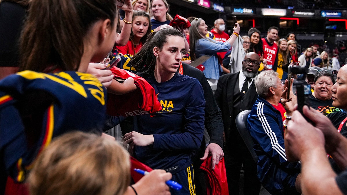 Caitlin Clark signs autographs