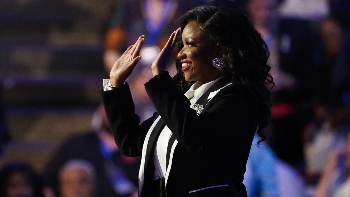 U.S. Rep. Jasmine Crockett (D-TX) waves during Day one of the Democratic National Convention