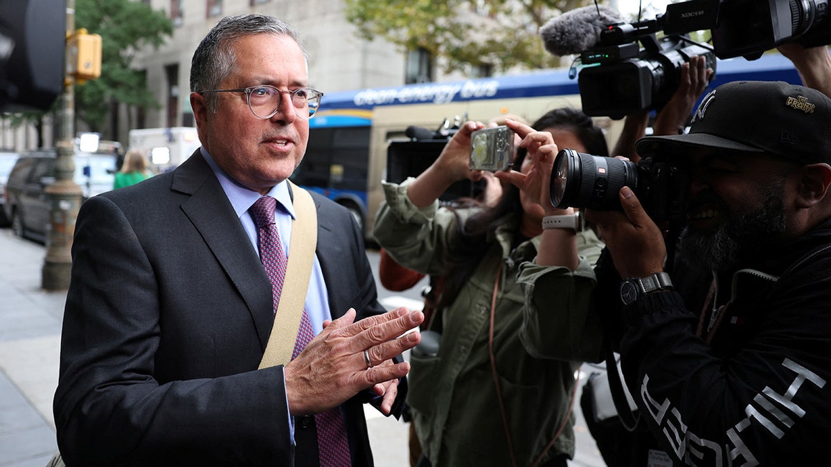 Marc Agnifilo speaks with media members outside United States Court in Manhattan after music mogul Sean 