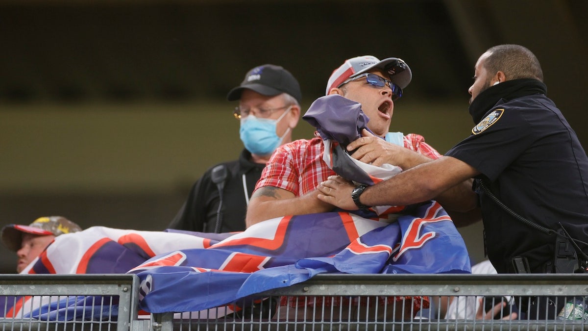 In the spring and summer of 2021, a man was removed from MLB games at Yankee Stadium, Fenway Park and Citizens Bank Park for hanging banners from the stands that read 