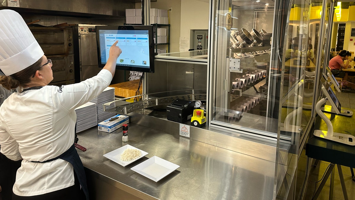 FIU chef Denisse Castillo looks at Beastro's incoming food orders.