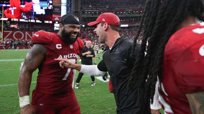 Kyzir White of the Arizona Cardinals celebrates with head coach Jonathan Gannon following a win against the Dallas Cowboys at State Farm Stadium on September 24, 2023 in Glendale, Arizona.