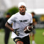 Travis Hunter Wears ‘Bland’ T-Shirt To UCF Game After Criticism From Richard Sherman, Amon-Ra St. Brown