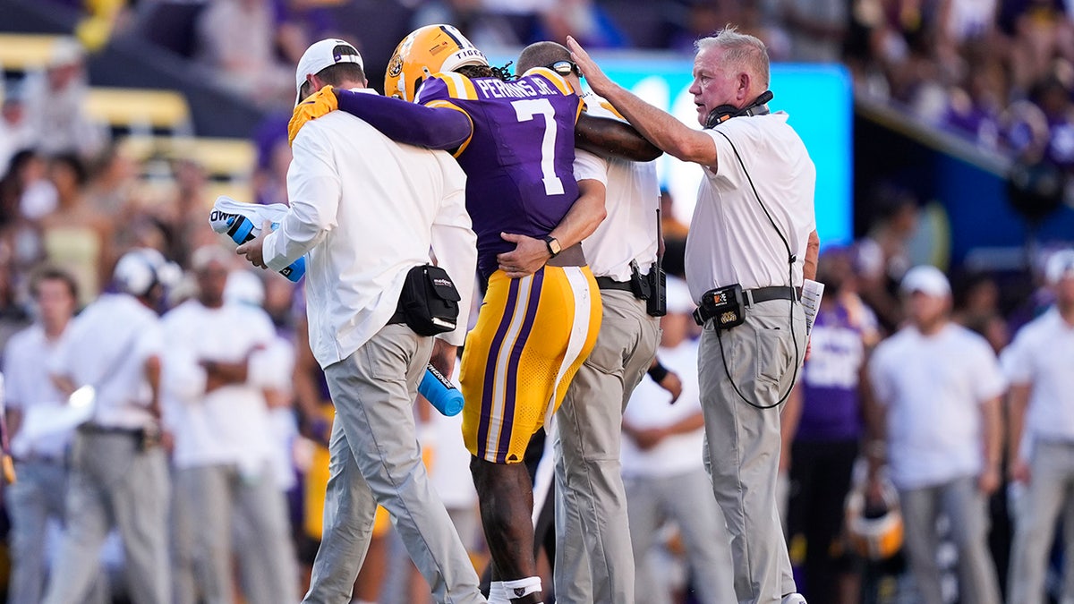 Harold Perkins Jr helped off the field