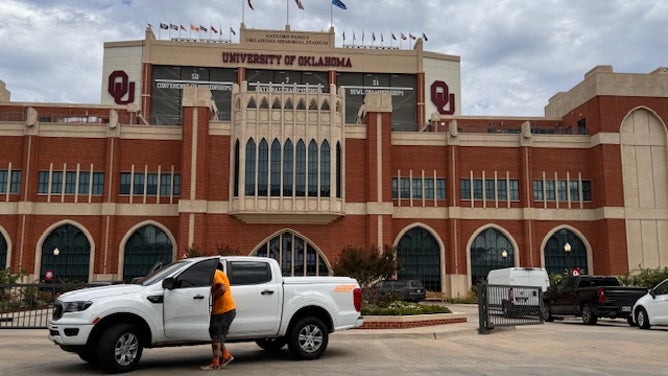 Tennessee fans take a stroll around the Oklahoma campus before the game on Saturday.