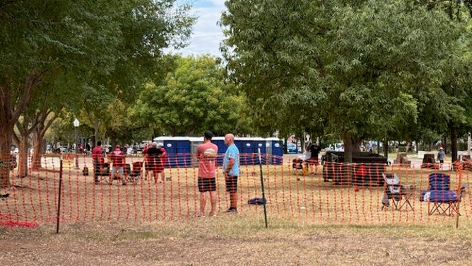 Oklahoma fans measure out their space for the tailgate area, preparing for Saturdays game against Tennessee Via: Trey Wallace