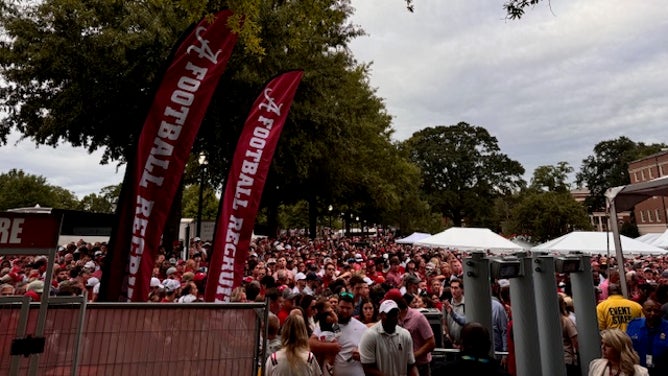 Alabama and Georgia fans wait in long lines to get through security, thanks to Donald Trump attending Via: Trey Wallace