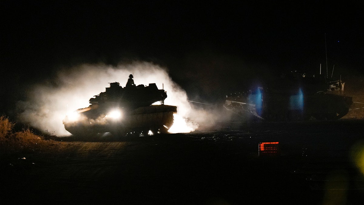 An Israeli tank manoeuvres in northern Israel near the Israel-Lebanon border