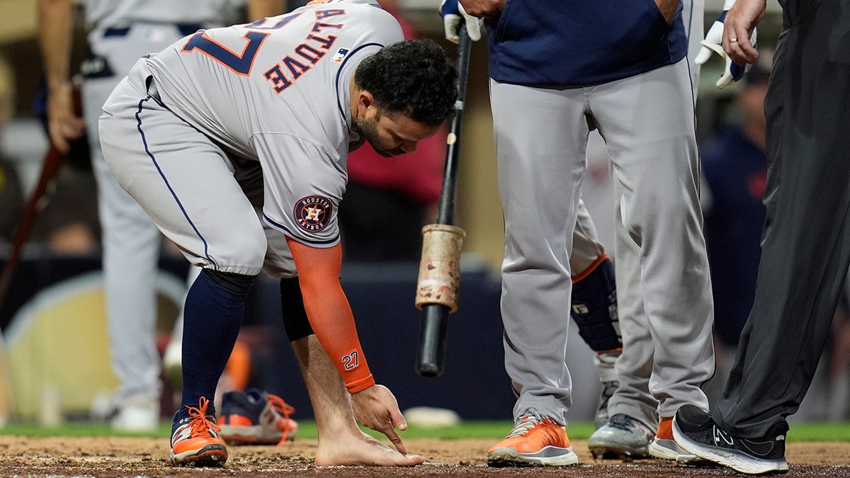 Jose Altuve argues with umpire