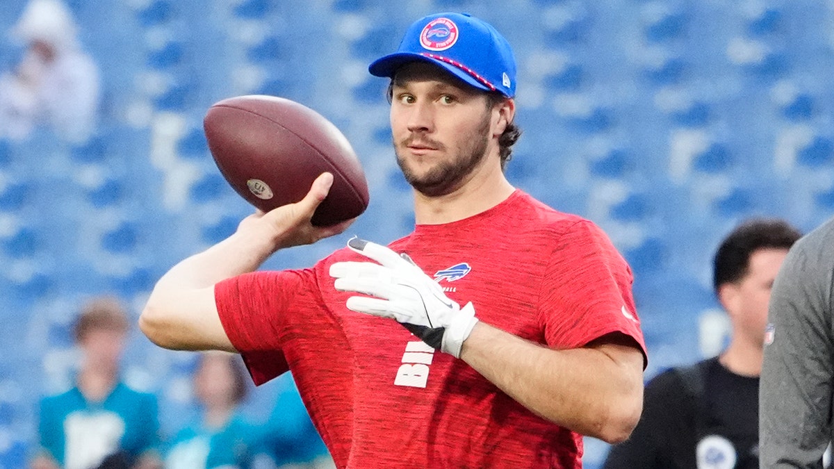 Josh Allen warms up