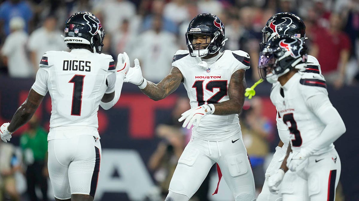 Nico Collins and Stefon Diggs celebrate