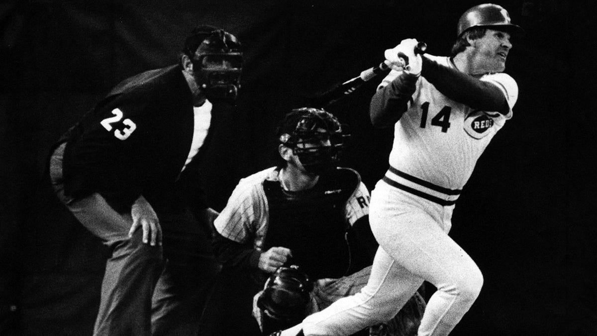 Umpire Lee Weyer and San Diego catcher Bruce Bochy have the best seats in the house as Pete Rose slaps hit No. 4,192 to break Ty Cobb's Record.