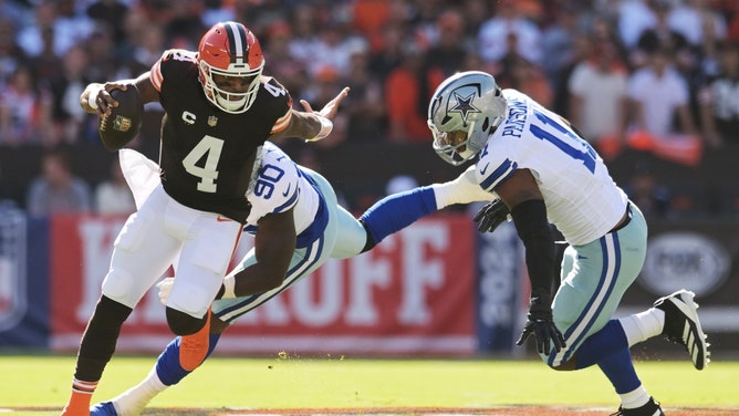 Dallas Cowboys pass rushers DeMarcus Lawrence and Micah Parsons chase Cleveland Browns QB Deshaun Watson at Huntington Bank Field in Ohio. (Ken Blaze-Imagn Images)