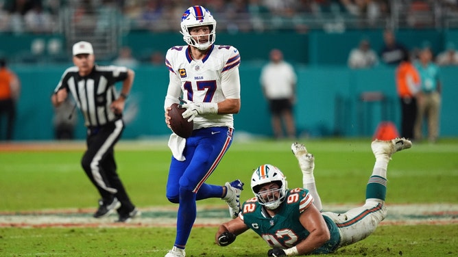 Buffalo Bills QB Josh Allen scrambles away from Miami Dolphins DT Zach Sieler during Thursday Night Football in NFL Week 2 at Hard Rock Stadium in Florida. (Jasen Vinlove-Imagn Images)