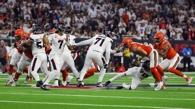 Houston Texans QB C.J. Stroud rolls out to throw vs. the Chicago Bears at NRG Stadium. (Thomas Shea-Imagn Images)