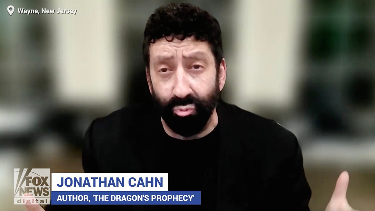 Jonathan Cahn talking about prophecy in a black shirt.