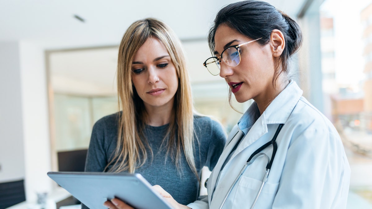 A doctor speaking with a patient 