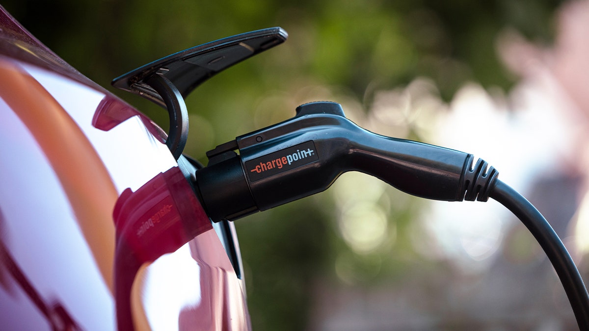 A Tesla Model 3 charges at a ChargePoint electric vehicle charging station in Rhinebeck, New York, on Tuesday, Sept. 3, 2024.