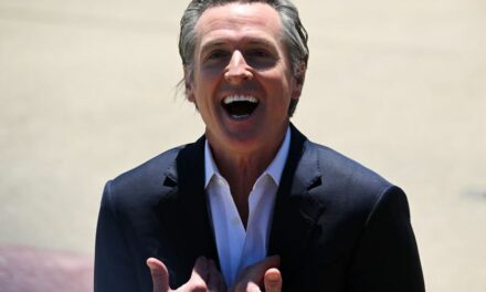 Gavin Newsom chuckles as he signs bills restricting AI use in election ads — but social media users may have last laugh