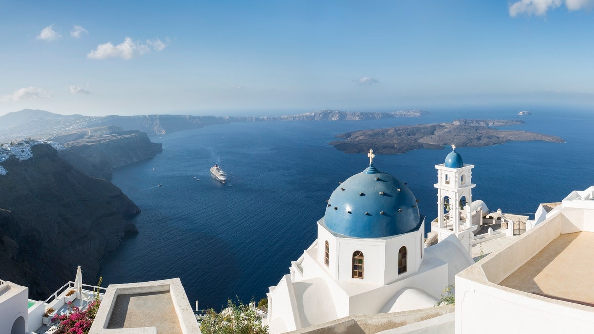 Santorini in Greece is one of the most famous travel destinations in the world, with numerous cruise ships anchoring in the bay. The architecture is also famous for the duo-tone colors of the white-painted buildings and light blue details.