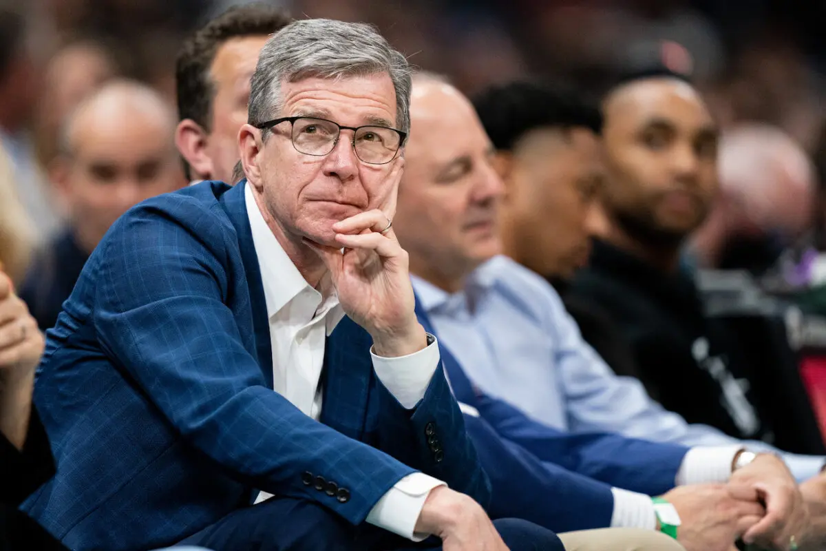 North Carolina Gov. Roy Cooper looks on during an NBA game at Spectrum Center in Charlotte, N.C., on April 7, 2022. (Jacob Kupferman/Getty Images)