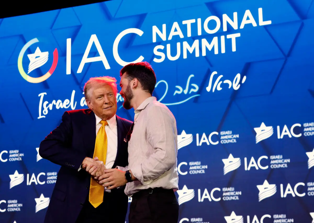 Former President Donald Trump welcomes rescued Hamas hostage Andre Kozlov to the stage as he speaks at the Israeli American Council National Summit at the Washington Hilton on Sept. 19, 2024. (Kevin Dietsch/Getty Images)