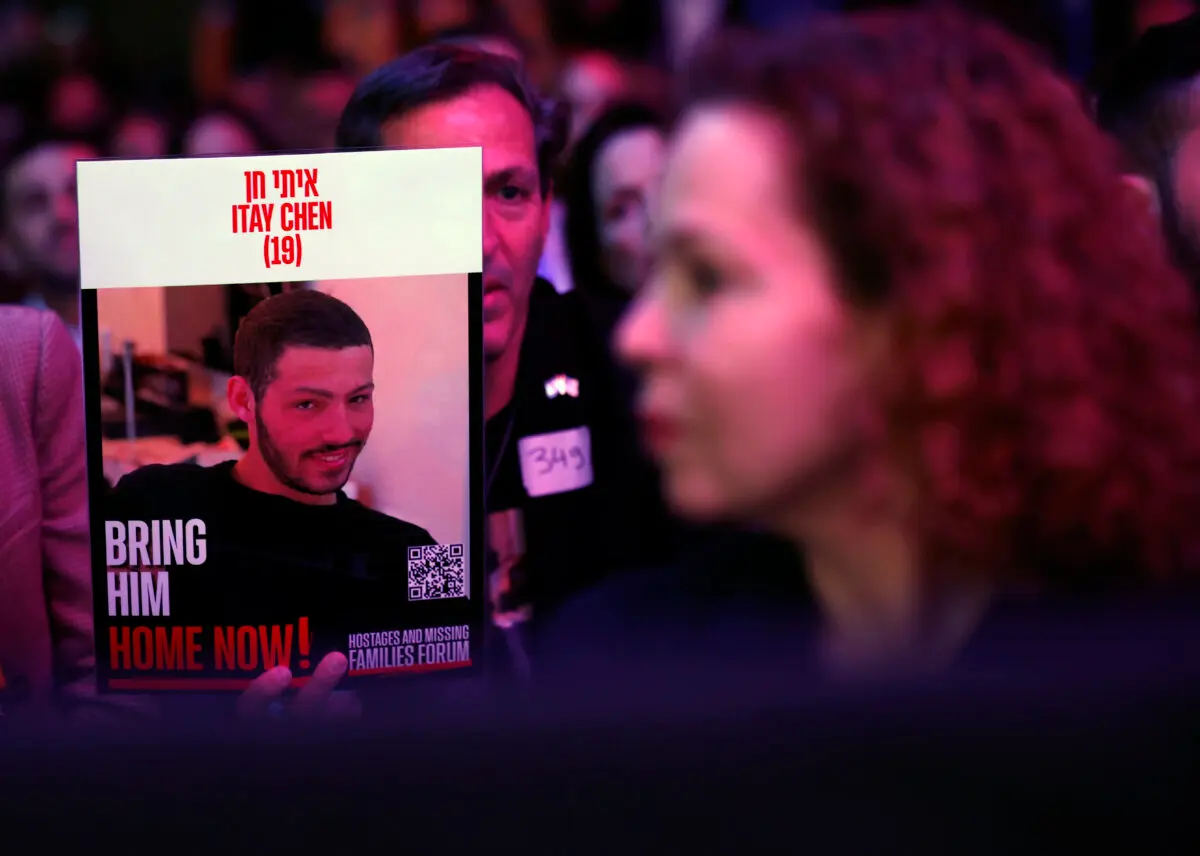 An audience members holds a poster as former President Donald Trump speaks at the Israeli American Council National Summit at the Washington Hilton on Sept. 19, 2024. (Kevin Dietsch/Getty Images)