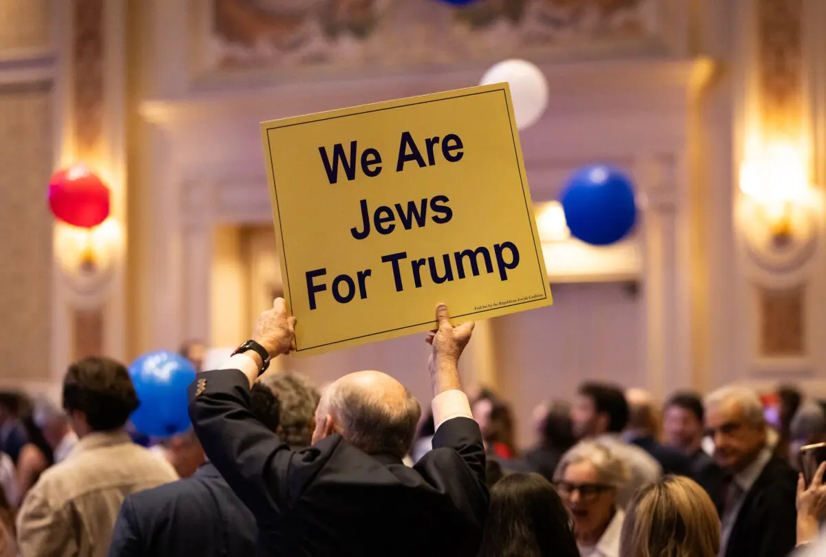 Attendee holds up a sign at the 2024 Republican Jewish Coalition meeting in Las Vegas, Nev., on Sept. 5, 2024. (John Fredricks/The Epoch Times)